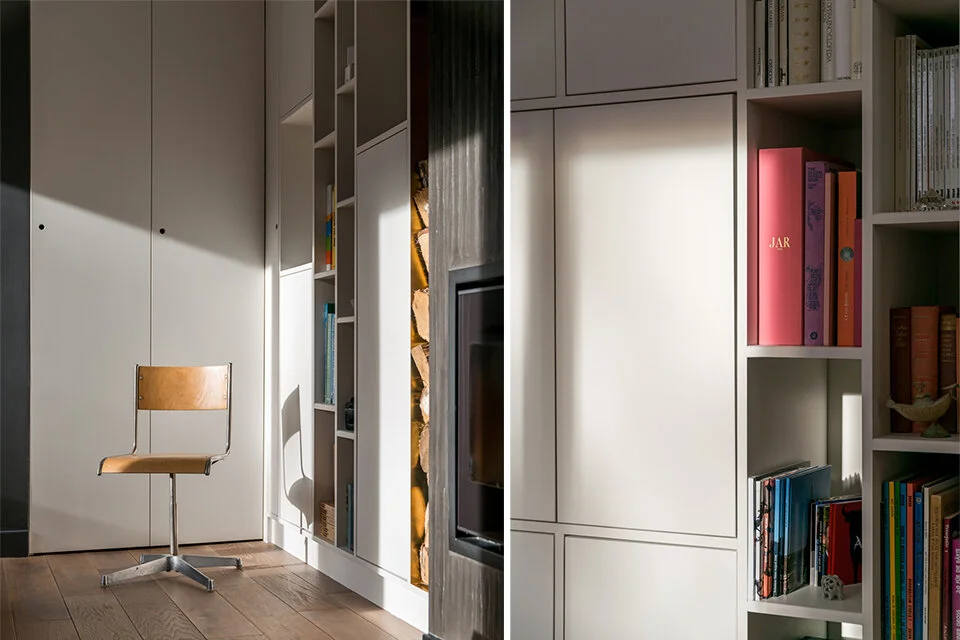 Desk and library wall with fireplace in the duplex study corner