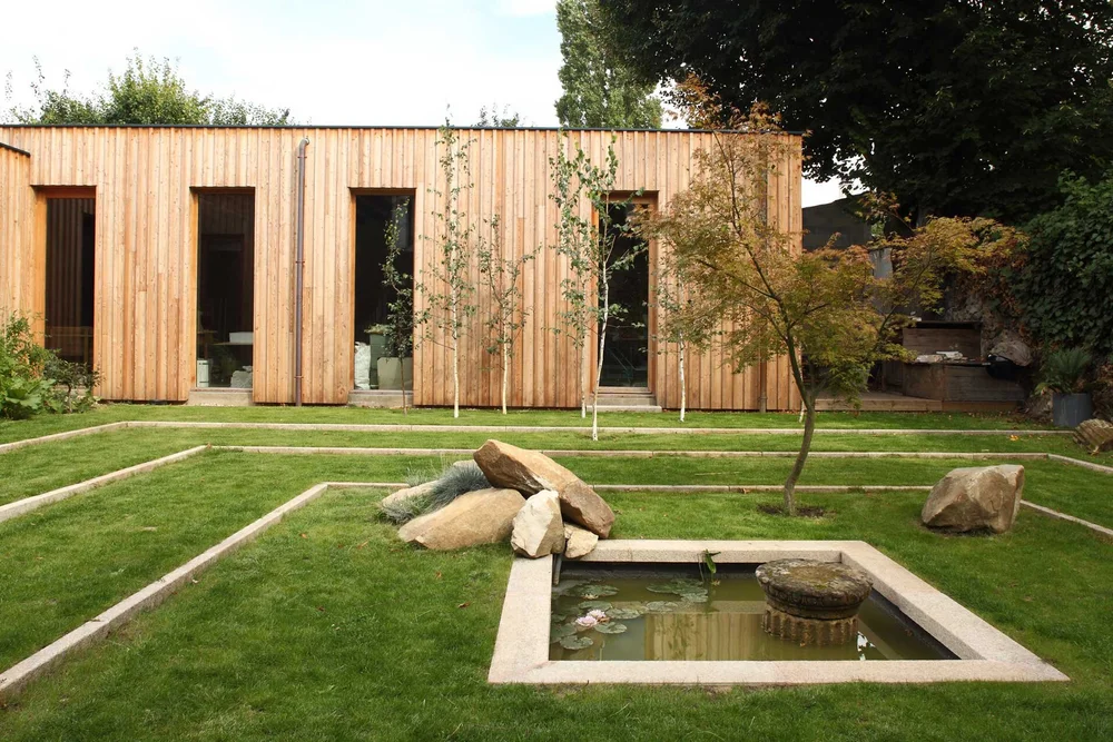 Larch-clad artist studio with Japanese-inspired garden, stone water basin and young maple trees, L'Haÿ-les-Roses