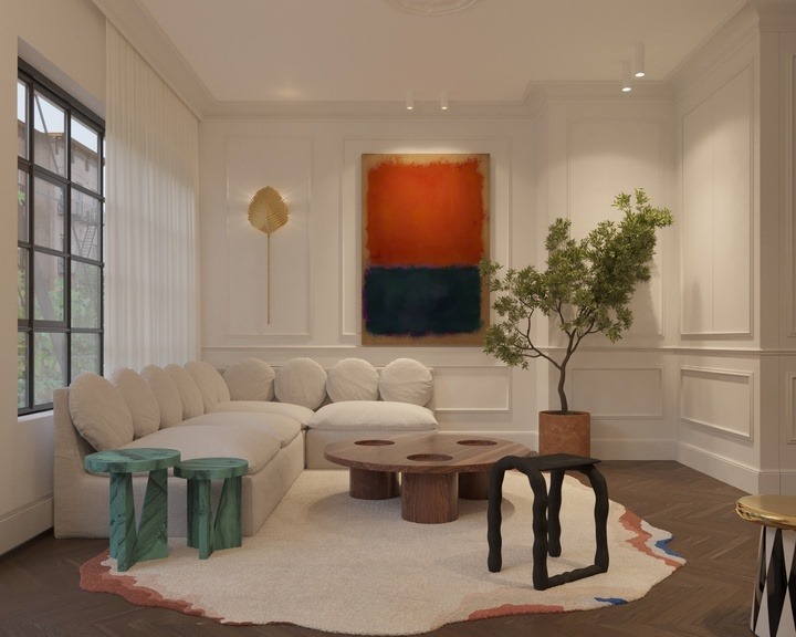 Bright duplex living room with curved sectional and abstract painting