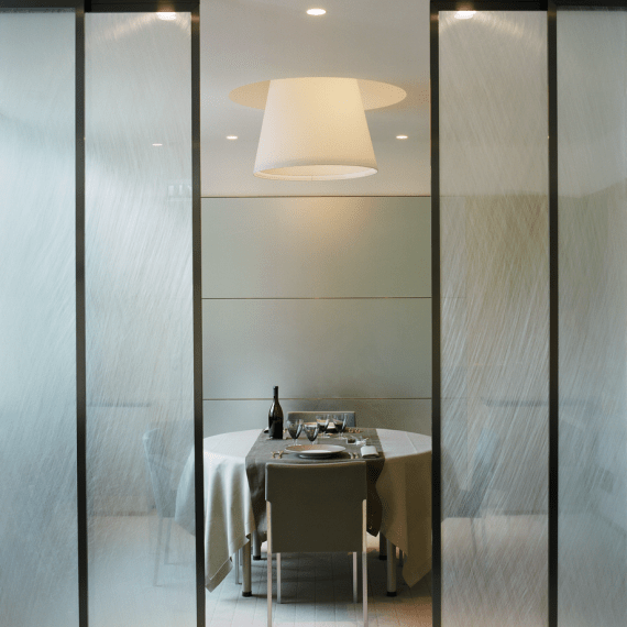 Air Liquide private dining room with round table and sculptural pendant