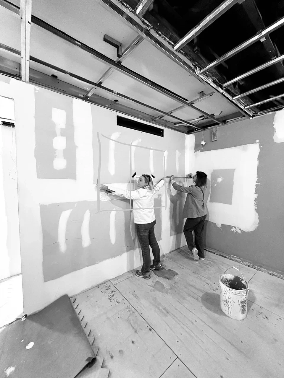 Fred and chef Alexia Duchêne marking full-scale design decisions on a construction wall
