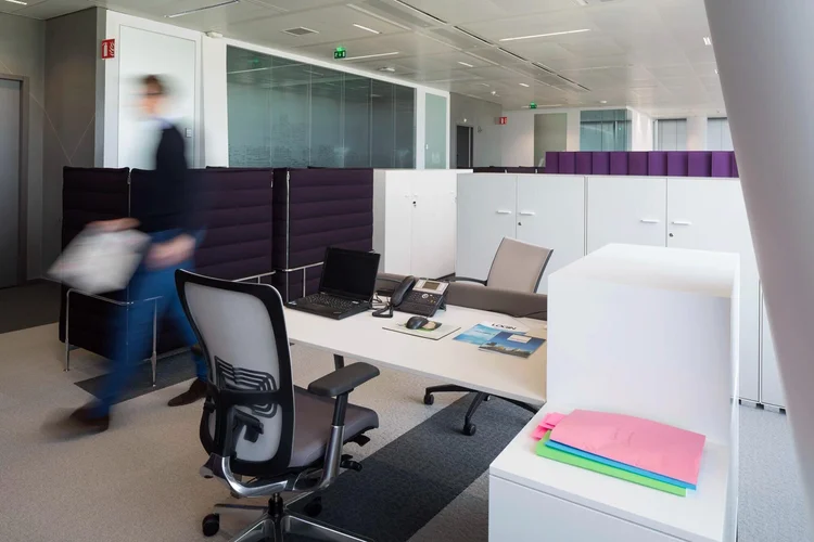 Thales workstations with purple felt screens and full-height white storage