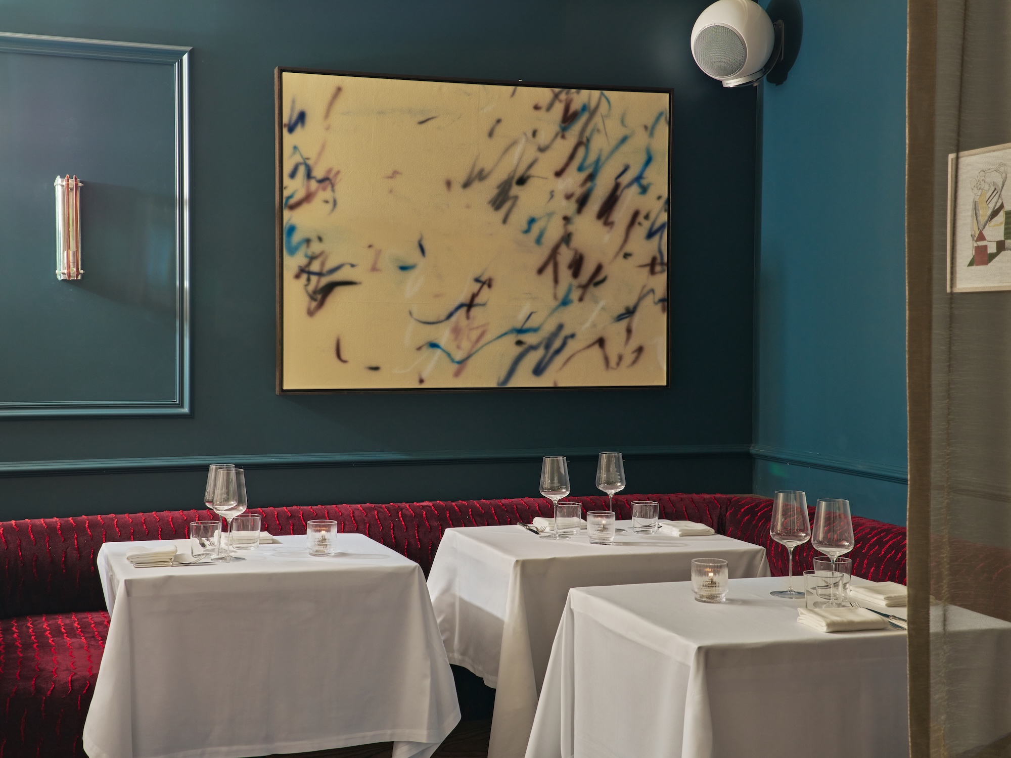 Le Chêne blue alcove with banquette seating